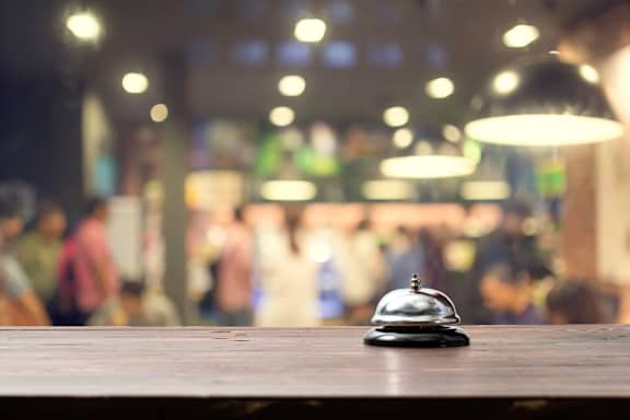 a bell sitting on top of a wooden table
