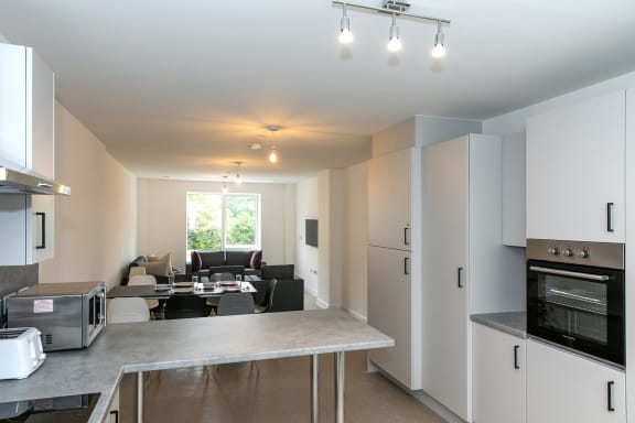 a kitchen and living room in a house