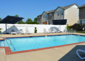 Thumbnail 16 of 22 - Outdoor pool with lounge chair seating and umbrellas