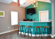 Thumbnail 19 of 22 - Clubhouse kitchen with counter height bar stool seating