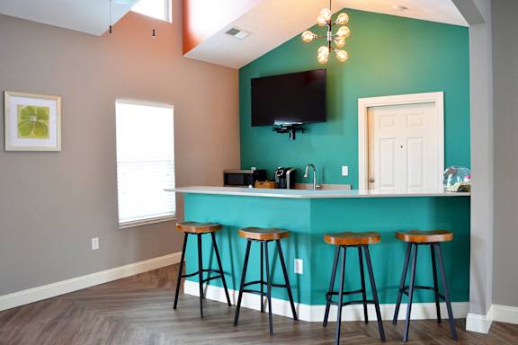 Clubhouse kitchen with counter height bar stool seating