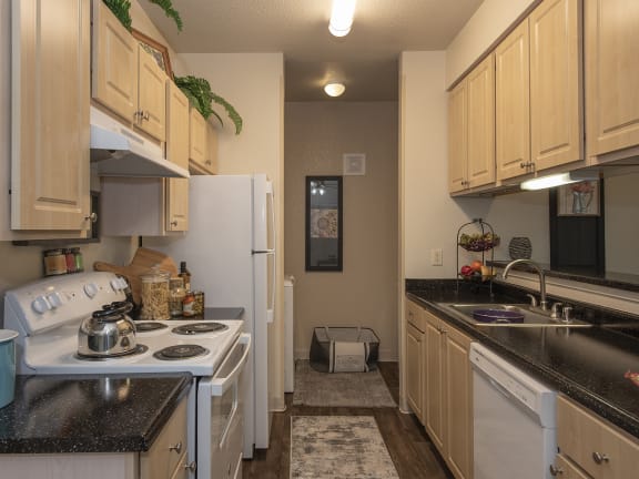 Model apartment kitchen and laundry at Sunset Summit in Rocklin, CA 95765