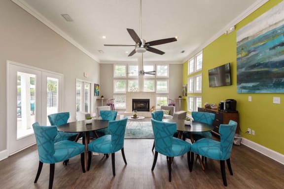 Dining Room with Blue Chairs at Ashton Creek in Chester, VA 23831