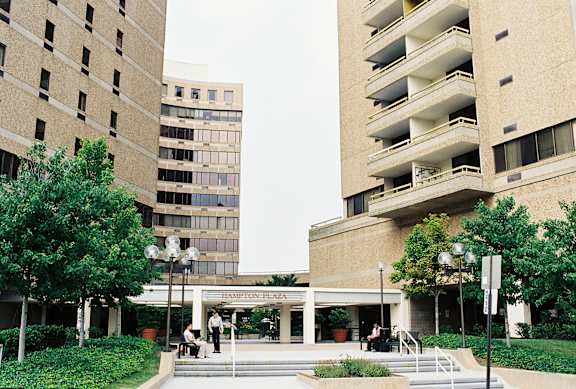 a group of people standing in front of a building at Hampton Plaza Apartments, Towson