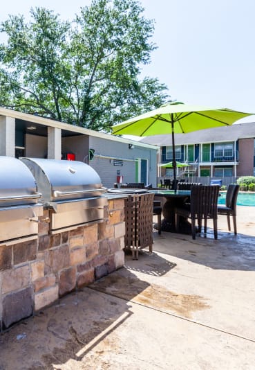 our apartments showcase a large patio with a bbq