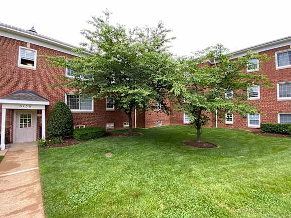 Building exterior and lawn at Patrick Henry Apartments Arlington VA