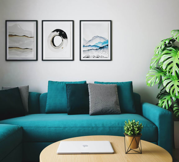 Grey couch and colorful throw pillows