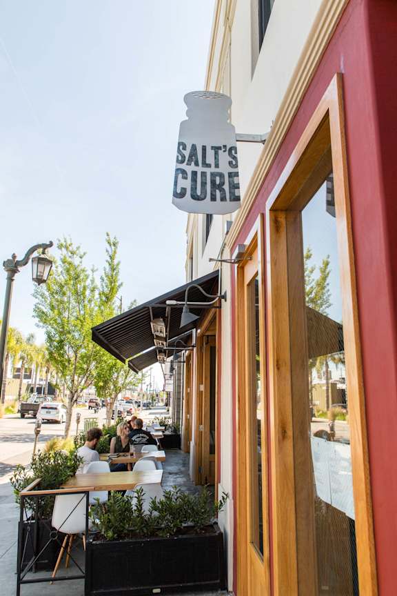 Salt's Cure is a restaurant with outdoor seating.