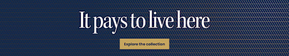 A blue background with the text "It pays to live here" and a button that says "Explore the collection".
