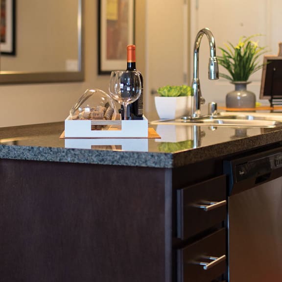Spacious Kitchen with Large Kitchen Island with Engrained Dishwasher, Drawers, and Kitchen Sink at The Crossings at Redlands, in Redlands, CA