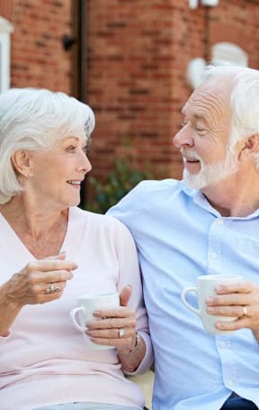 a man and a woman looking at a tablet computer