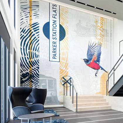 a lobby with a staircase and a painting of a bird on the wall