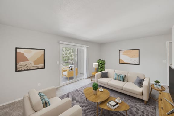 a living room with couches and a table at 2300 West Apartments, Nevada, 89502
