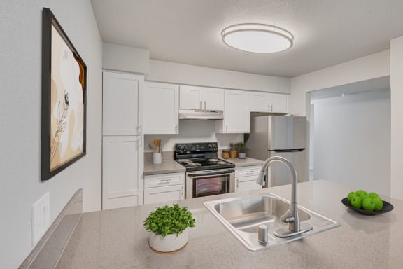 a kitchen with white cabinets and a sink at 2300 West Apartments, Nevada, 89502
