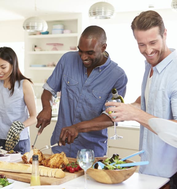a group of people preparing food in a kitchen at The Lennox, Las Vegas