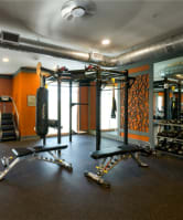 a large fitness room with exercise equipment and a large window