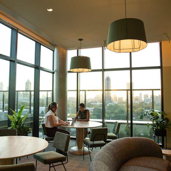Two People sitting at a table1 at Scout Living, powered by Placemakr, Atlanta, Georgia