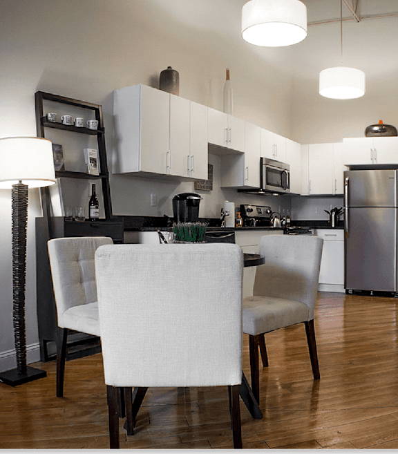 Open concept kitchen and dining area at Star Mill Lofts Apartments, Middleboro, MA
