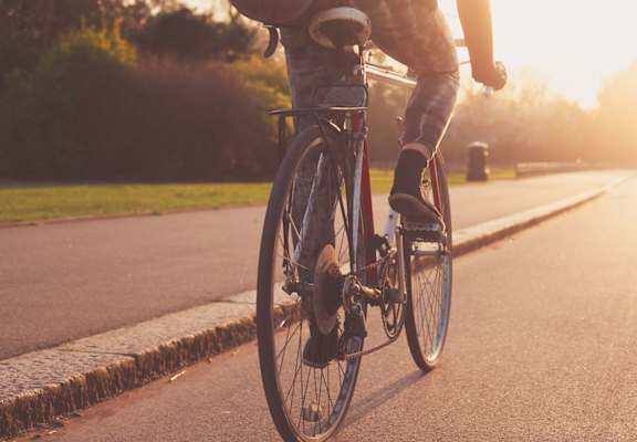 A person riding a bicycle on a road.