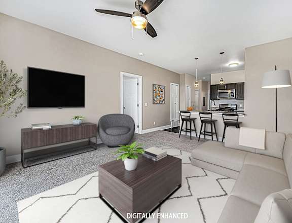 A living room with a television, a couch, a coffee table, and a ceiling fan.
