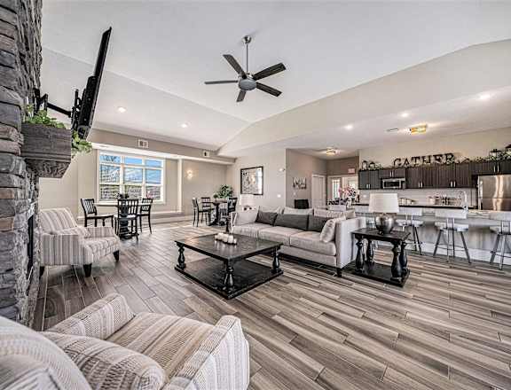a living room with a couch and a table at Trade Winds Apartment Homes in Elkhorn, NE 68022