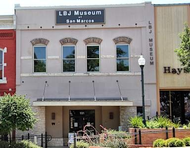 The LBJ Museum in San Marcos is a two-story building with a red brick exterior.