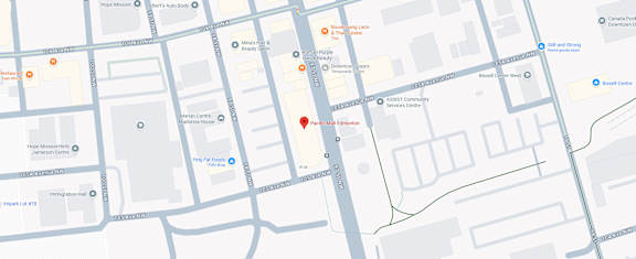 A map with a red pin on a street.