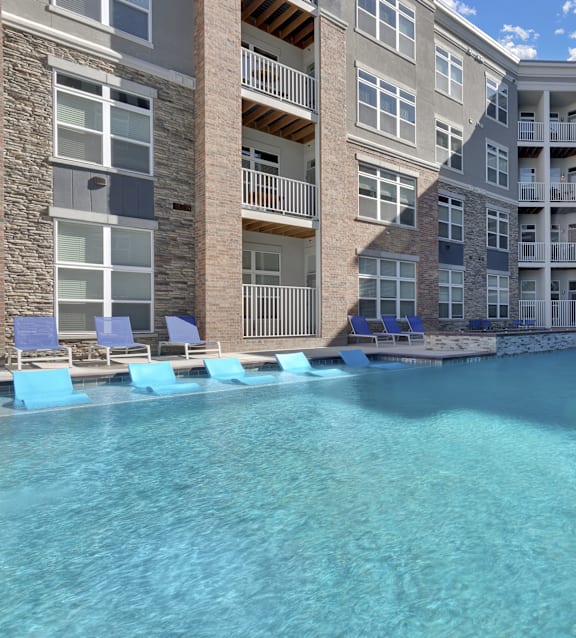 The Edison at Wheat Ridge Apartments in Wheat Ridge, Colorado Pool with Lounge Chairs