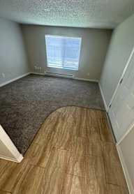 A room with a window and a door.