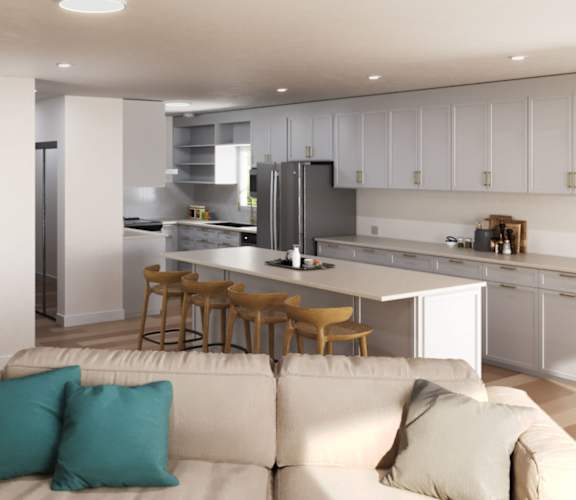 A modern kitchen with a bar stool and a couch at Ocean Edge @ Laguna Beach Apartments, Laguna Beach, California
