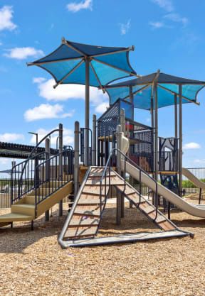 a playground with a swing set and a slide