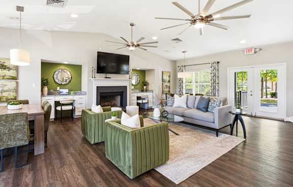 A living room with a fireplace and a television.