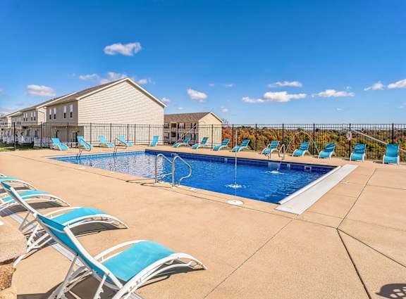 our apartments have a large pool and lounge chairs