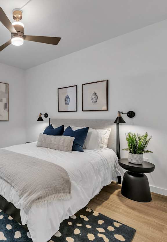 Cozy bedroom at The James On Merrimac Apartments, Williamsburg, VA