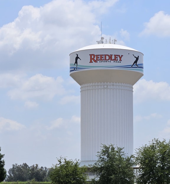 a water tower with a sign on it