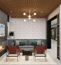 A modern living room with a fireplace and a grey sofa at Two 10 by Vintage, Shoreline, Washington