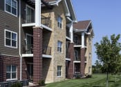 Thumbnail 19 of 26 - exterior shot of apartment building with large balconies