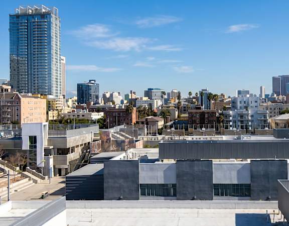 A cityscape with a clear blue sky above.