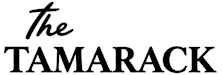 The image features the text "The TAMARACK" in black, with the first word in a cursive font and the rest in a bold, sans-serif font.