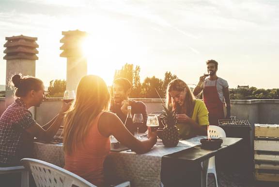 Group of People at a Table at Sunset at an Art Museum at The Locks Tower in Richmond, Virginia