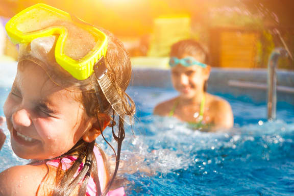This is a photo of two young girls swimming.
