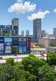 A cityscape with a highway and buildings.