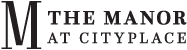 a city in the desert with mountains in the background