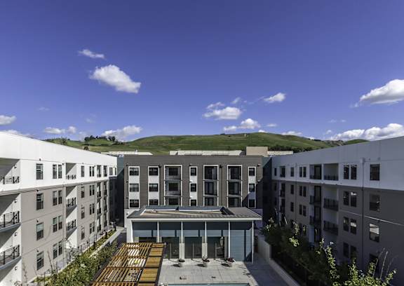 A modern building with a courtyard in the middle of it.