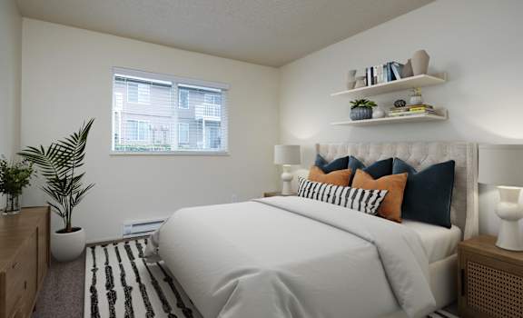 A bedroom with a large bed and a window.