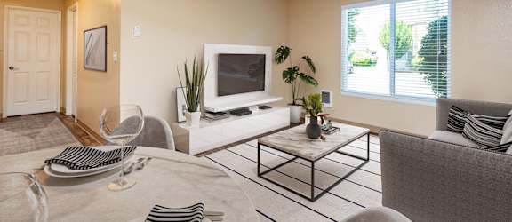 our apartments offer a living room and dining room with a tv