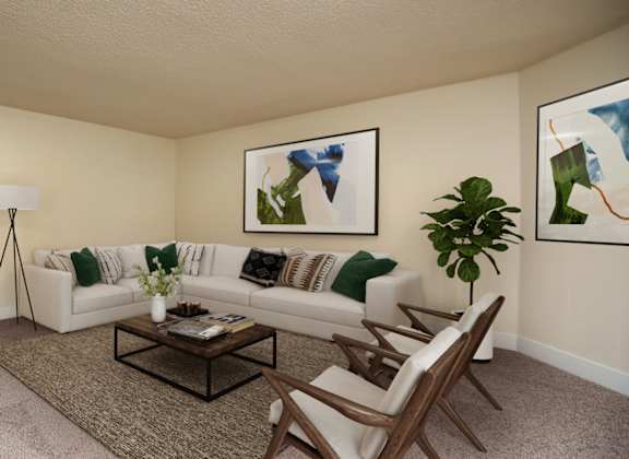 A living room with a white couch, a coffee table, and two abstract paintings on the wall.