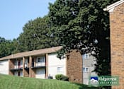 Thumbnail 7 of 7 - Apartment complex with a sign that says Ridgecrest Apartments.
