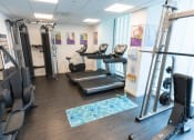 Thumbnail 1 of 8 - a room filled with lots of different types of exercise equipment