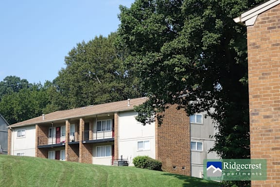 Apartment complex with a sign that says Ridgecrest Apartments.